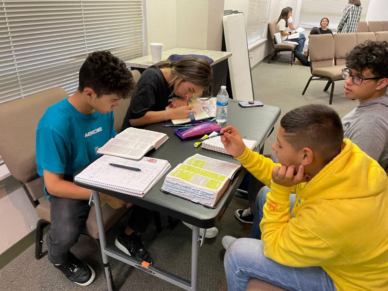 Students studying Bible together